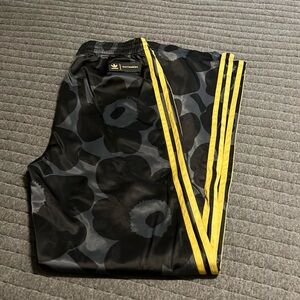 Womens adidas x marimekko pants.  Black print with gold size small